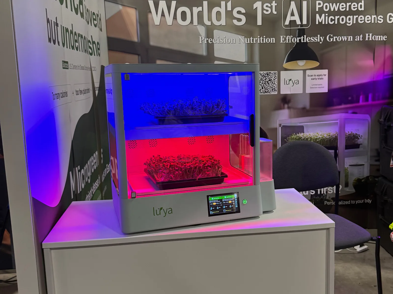 A Luya X-1 on the CES stand, two trays under blue and red light